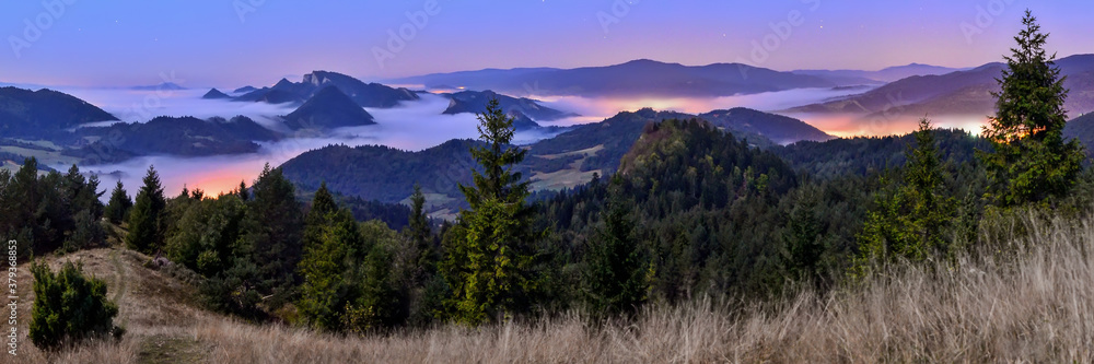 beautiful landscape with valleys, lakes and rivers in night fog