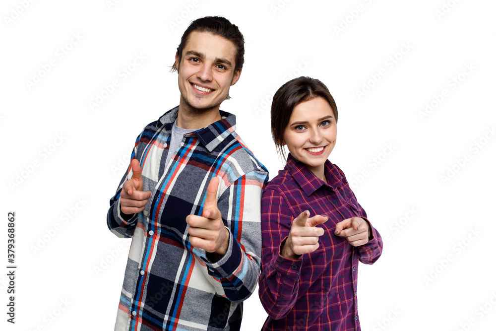 Image of young pretty couple posing together and looking away over white background Image of young pretty couple posing together and looking away over white background