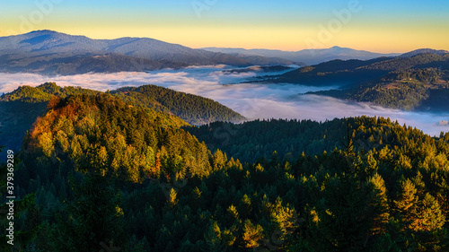 beautiful landscape with valleys  lakes and rivers in fog