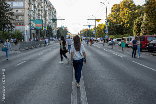 Beautiful young woman walking on the street © IhorStore