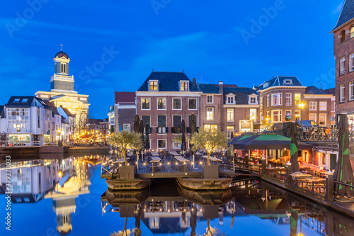 Evening view of the Dutch historic city center with water, terraces and restaurants in Leiden, The Netherlands photo