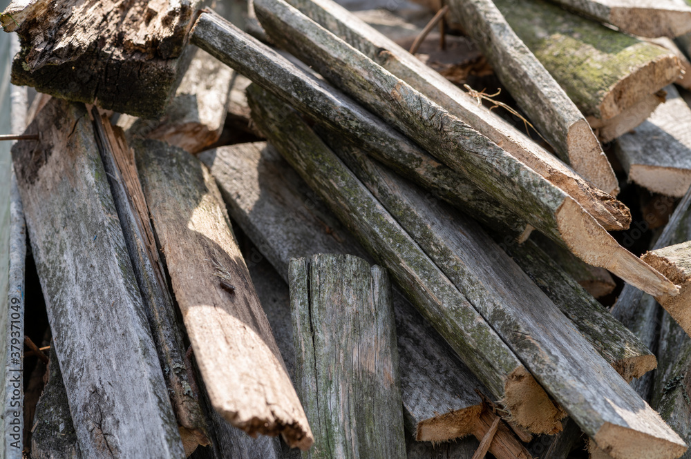 a bunch of oldA pile of old boards suitable for the furnace, close-up, selective focus. boards a bunch of oldA pile of old boards suitable for the furnace, close-up, selective focus. boards