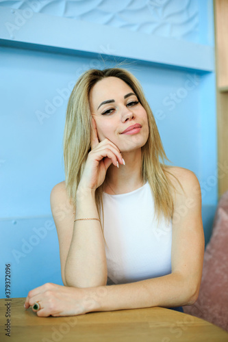 Young woman sitting at the table