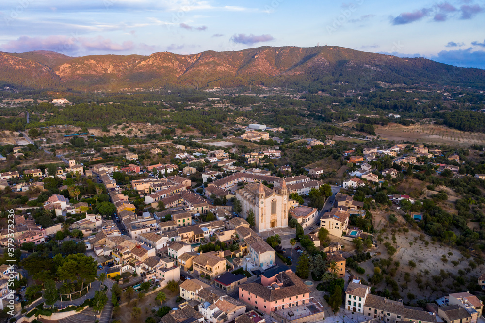 Aerial view, municipality of Calvia with the Església Sant Joan Baptista church, on the edge of the Tramuntana mountains, Mallorca, Balearic Islands, Spain