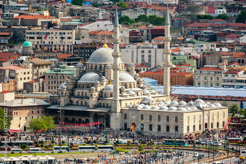 Aerial view of Yeni Cami mosque and Galata bridge during the day in Istanbul, Turkey photo
