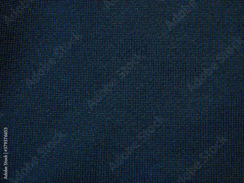DArk blue grungy canvas background or texture with dark vignette borders