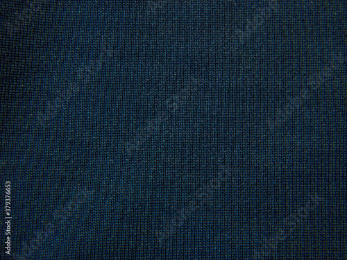 DArk blue grungy canvas background or texture with dark vignette borders photo