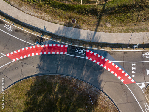 Aerial drone view. Automobile road with bicycle lane markings.
