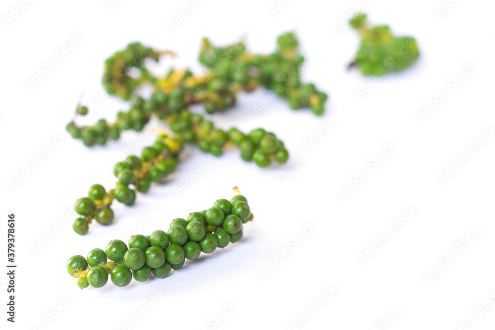 The fresh green peppercorns on white background The fresh green peppercorns on white background