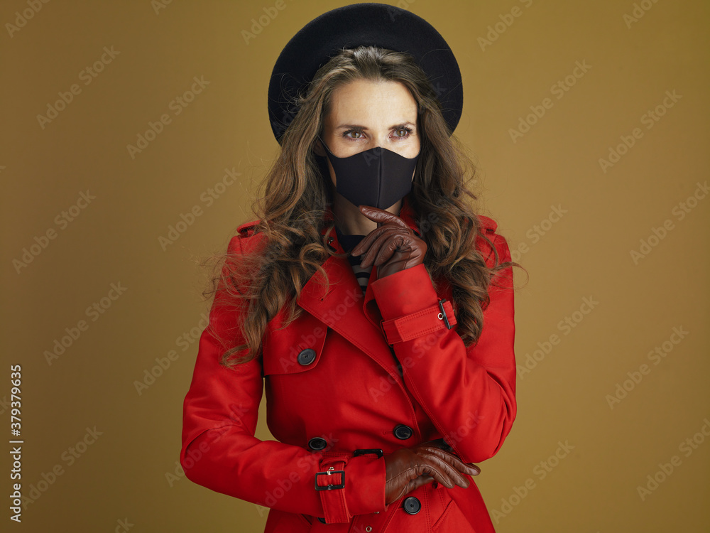 pensive elegant woman in coat isolated on beige pensive elegant woman in coat isolated on beige