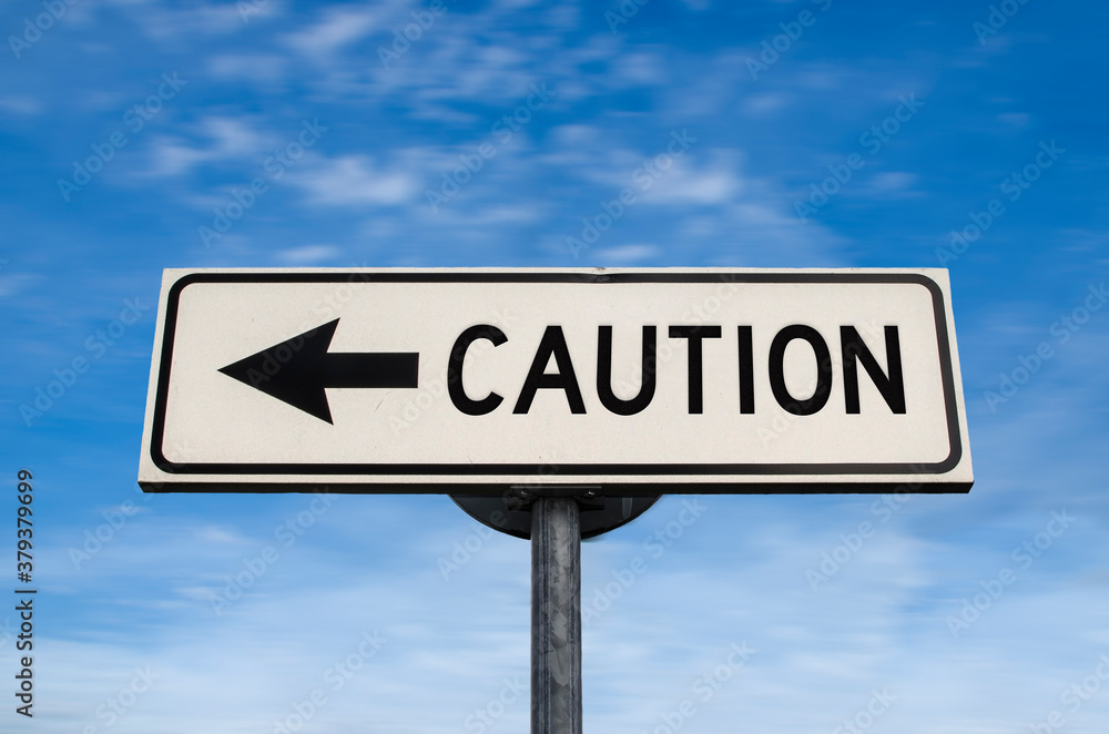 Caution road sign, arrow on blue sky background. One way blank road sign with copy space. Arrow on a pole pointing in one direction. Caution road sign, arrow on blue sky background. One way blank road sign with copy space. Arrow on a pole pointing in one direction.