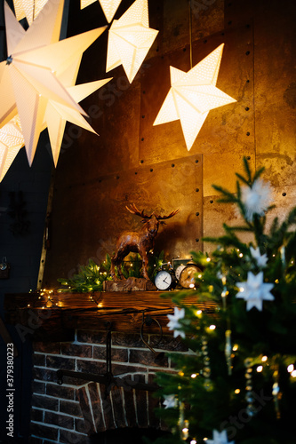 the details. Christmas decor of the house with a fireplace. cozy holiday interior of a country house. new year.
