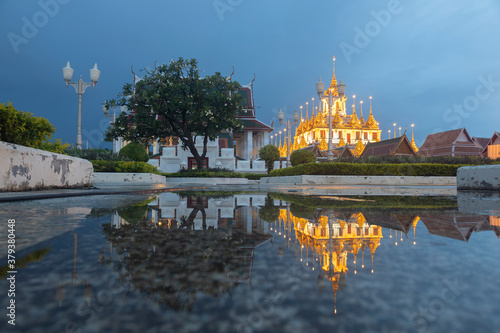 Reflection of Wat Ratchanatdaram Temple the beautiful golden castle or pagoda Bangkok, Thailand