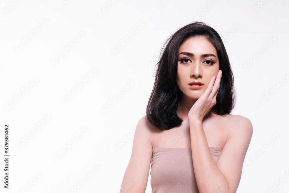 Charming young woman touching her face with clean fresh skin. Teenager with perfect skin over isolated white background. Beauty cosmetics and healthy concept. Charming young woman touching her face with clean fresh skin. Teenager with perfect skin over isolated white background. Beauty cosmetics and healthy concept.