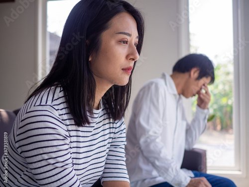 An Asian woman is stressed and anxious about the love problems between her husband after an intense quarrel. Concepts of lovers having family problems, divorce or quarrels or conflicts