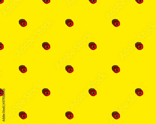 pattern red tomatoes on a yellow background