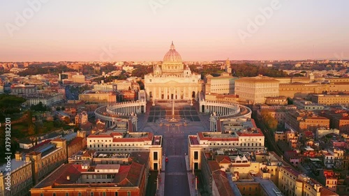 rome vatican city st peter basilica aerial view at sunrise,drone moving out from the house window photo