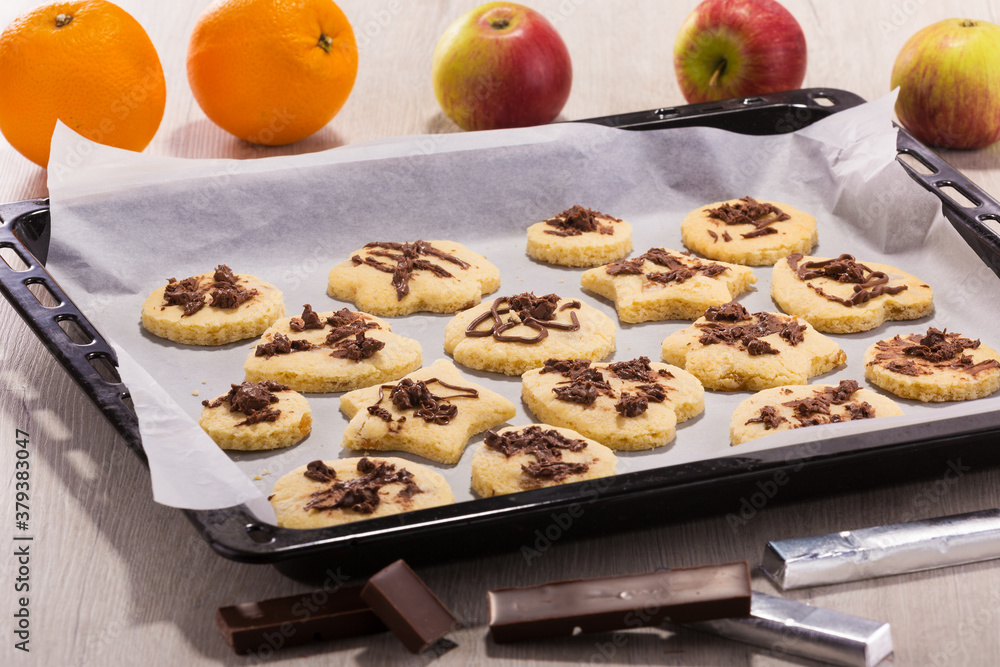 delicious cookies on a baking sheet from the oven decorated with chocolate delicious cookies on a baking sheet from the oven decorated with chocolate