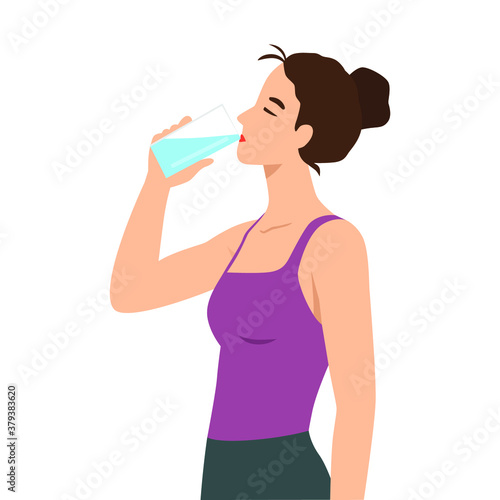 Attractive young woman is drinking water from a plastic bottle. Fitness and health.