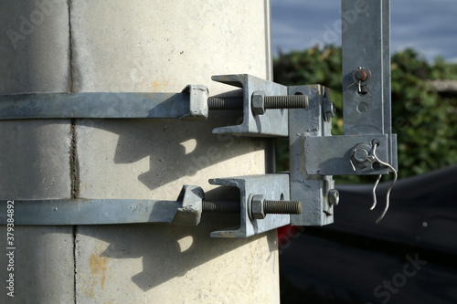 Clamps with fixing bolts on an electric pylon