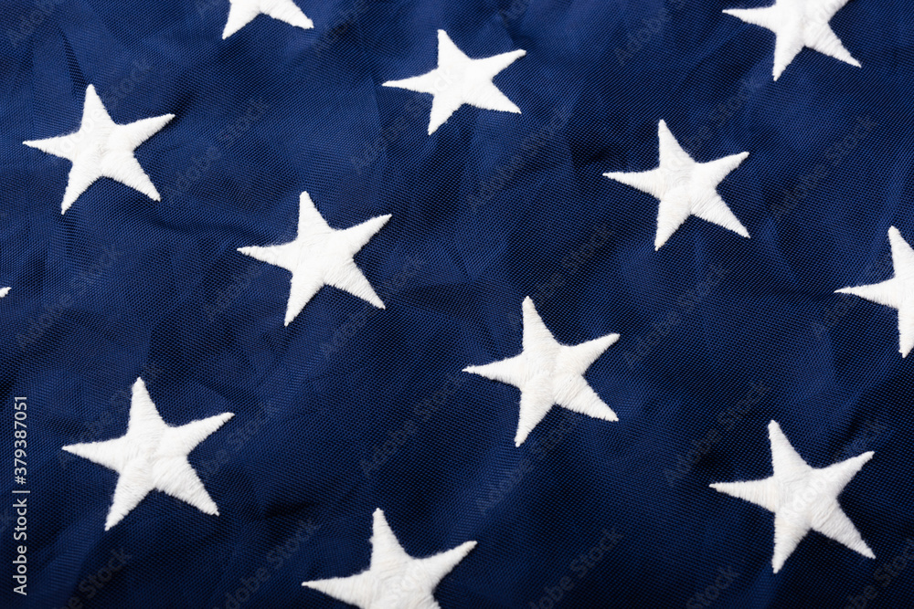 Full frame of white stars on blue of the America United States flag, symbolizing background for use, Veterans or Independence day concept Full frame of white stars on blue of the America United States flag, symbolizing background for use, Veterans or Independence day concept