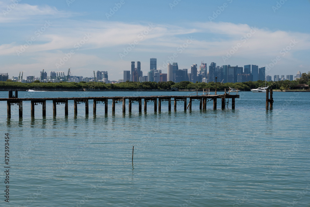 Fototapeta premium Singapore skyline seen from St. John's Island, and offshore island south of Singapore