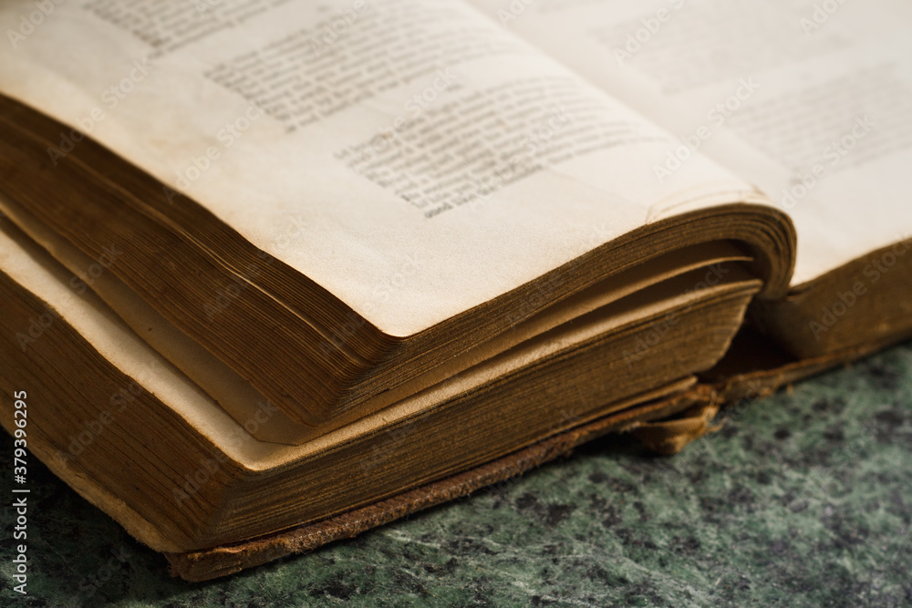 Obraz premium Old book close-up on marble