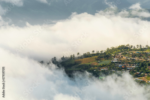 beautiful view sunrise of village on mountain with morning mist in Thailand, travel, landscape and nature concept