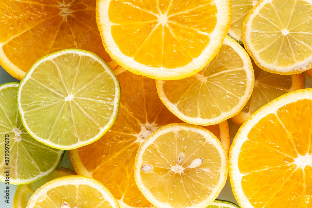 sliced colorful juicy assorted citrus  fruits shot from above flat lay