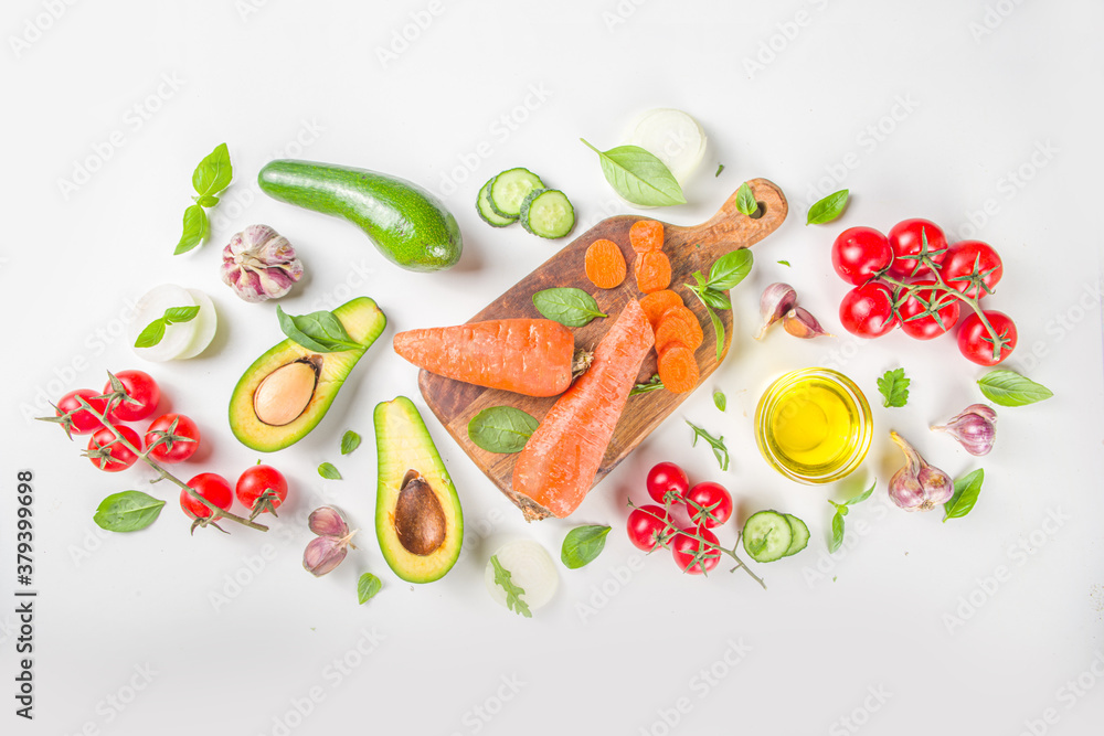 Organic fresh raw vegetables flatlay. Healthy food cooking background with various vegetable salad ingredients. Vegetarian fresh raw food concept. Top view, copy space Organic fresh raw vegetables flatlay. Healthy food cooking background with various vegetable salad ingredients. Vegetarian fresh raw food concept. Top view, copy space