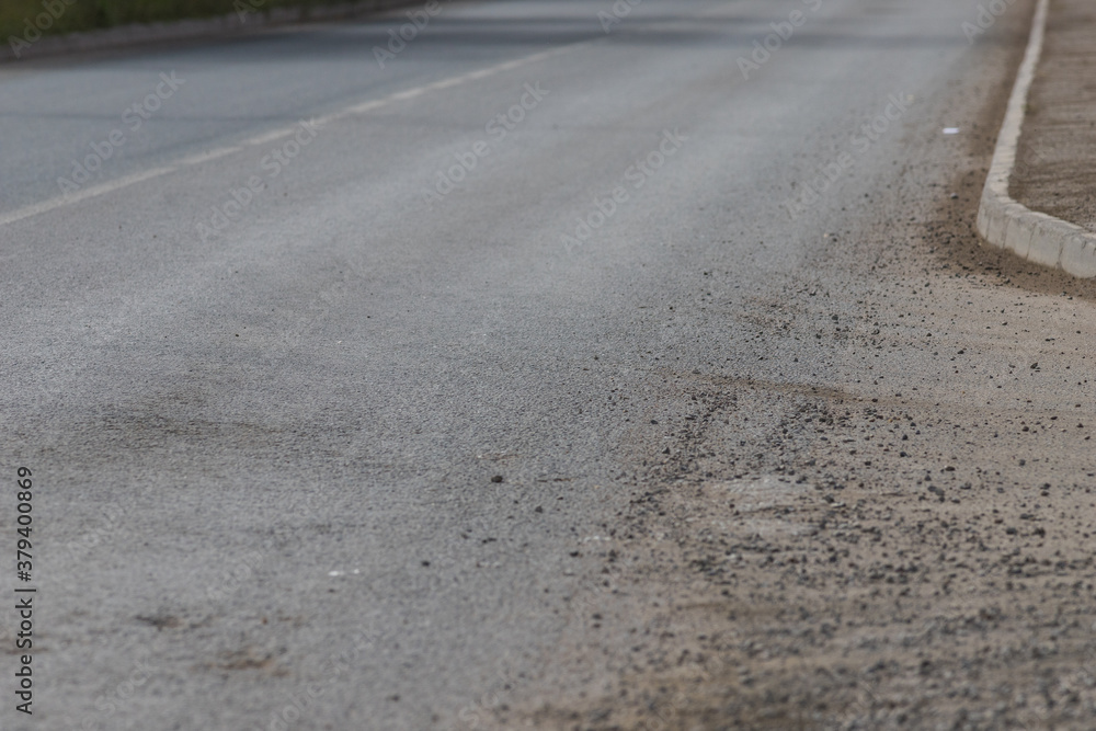 Naklejka premium Light grey asphalt on the new road