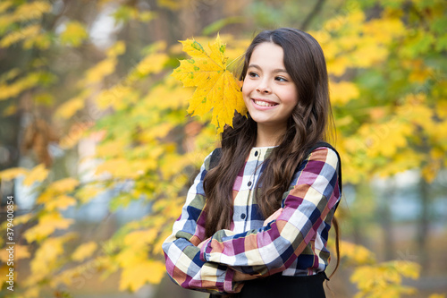 happt kid with yellow maple leaves, childhood photo