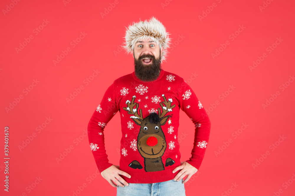Winter care. Emotional guy. Winter mood. Bearded hipster wear knitted sweater and furry hat. Weather forecast. Winter fashion. Cold days. Barbershop services. Man with long beard and mustache