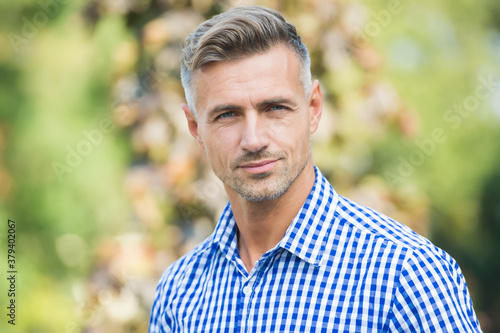 handsome mature guy in shirt outdoor, fashion