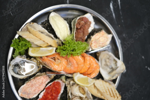 a plate of assorted seafood on a white background close-up