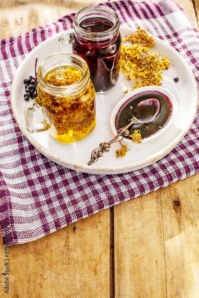Elderberry tea from ripe berries and dried flowers Elderberry tea from ripe berries and dried flowers