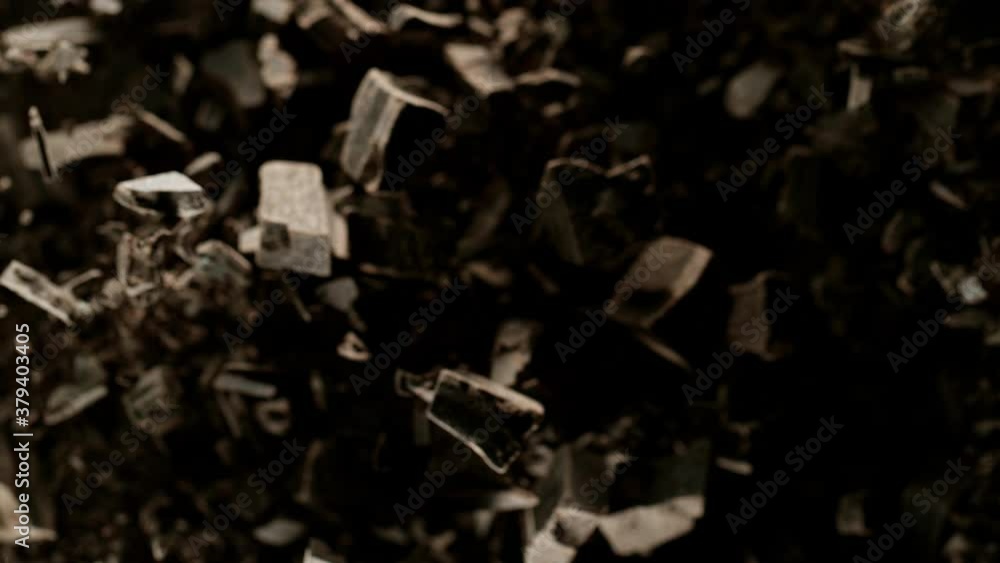 Super slow motion of flying group of raw chocolate pieces on black background. Filmed on high speed cinema camera, 1000fps. Super slow motion of flying group of raw chocolate pieces on black background. Filmed on high speed cinema camera, 1000fps.