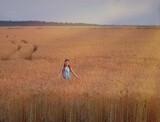 a girl in a wheat field