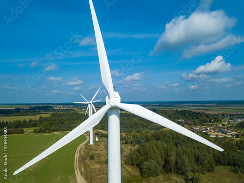Drone view of a wind turbine on a Sunny day. Environmental friendliness, the concept of renewable energy sources.