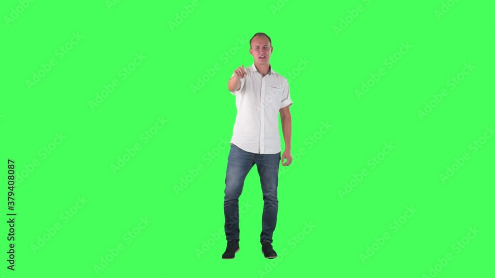 Furious angry business man pointing finger blaming and accusing while yelling at camera. Full body on green screen. Furious angry business man pointing finger blaming and accusing while yelling at camera. Full body on green screen.