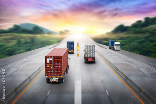 Truck transport container on highway at sunset, motion blur effect, logistics import export background and cargo transport industry