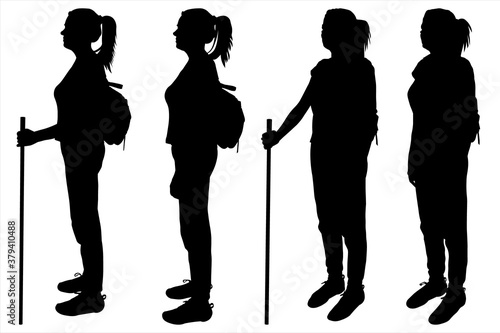 Four black female silhouettes are isolated on a white background. A girl with a backpack and a track stick. Walking. Hiking. Team. Side view, profile. Woman stands behind each other.