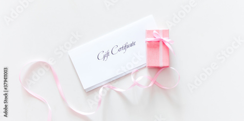 Gift Certificate and pink present box 