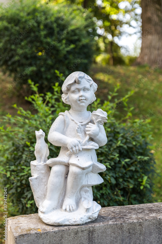 Little angel statue in the park. Little angel statue in the park.