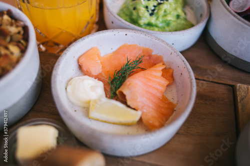 Cropped image of tasty healthy meal with freshness salmon slices for eating during lunch break, breakfast presentation in restaurant with organic vegetarian food dish full of omega vitamins
