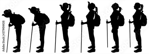 Tourist with a backpack on her back and a walking stick. Group of tourists follow each other. Hiking. Girl leans and looks away. Female silhouette is isolated on a white background.
