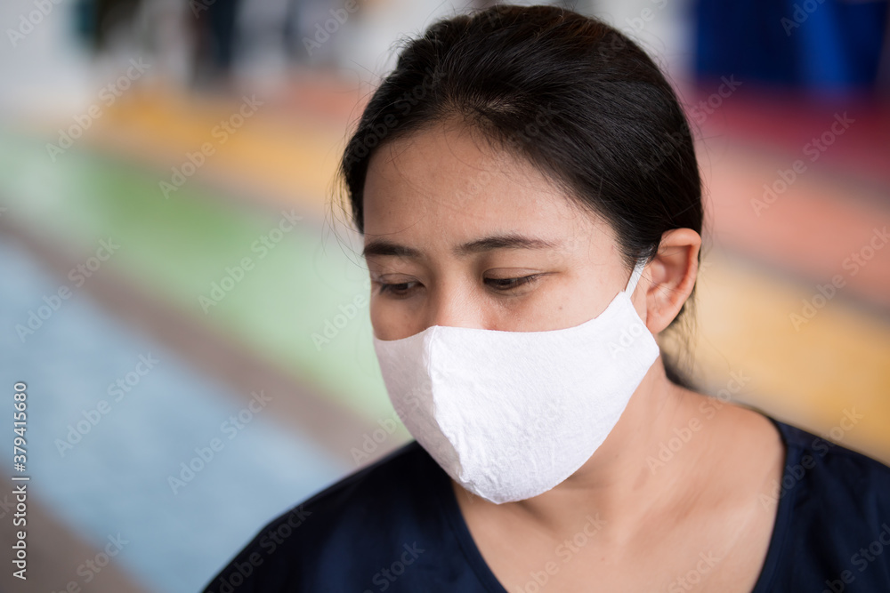 Snap shot of Asian women wearing white cloth masks to prevent the spread of the coronavirus and PM 2.5 dust toxic.