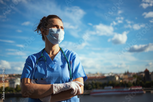 Принти на полотні confident modern medical doctor woman outside against sky