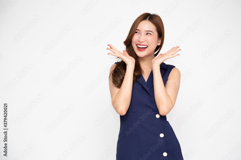 Portrait of excited screaming young asian woman standing in blue dress isolated over white background, Wow and surprised concept Portrait of excited screaming young asian woman standing in blue dress isolated over white background, Wow and surprised concept