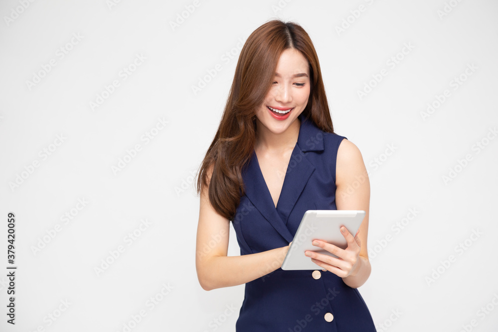 Happy asian business woman using tablet isolated on white background